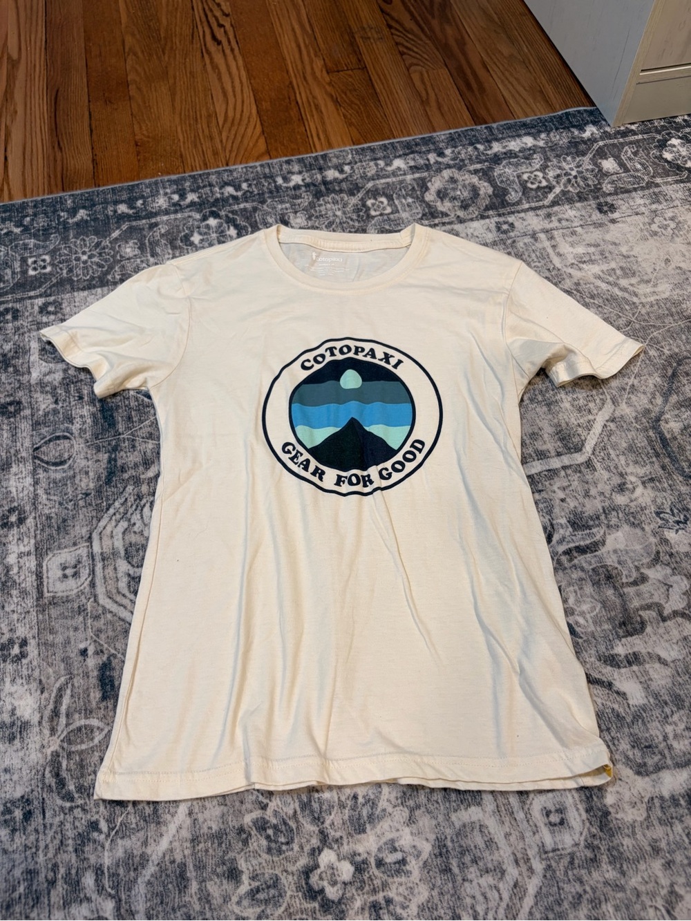 cotopaxi Cream Short-Sleeve Tee with Blue Mountain Emblem